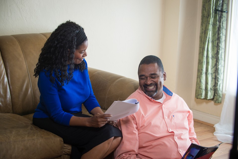 Members reviewing paperwork at home